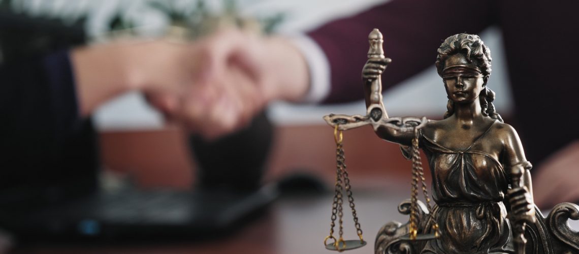 Military attorney shaking hands with client