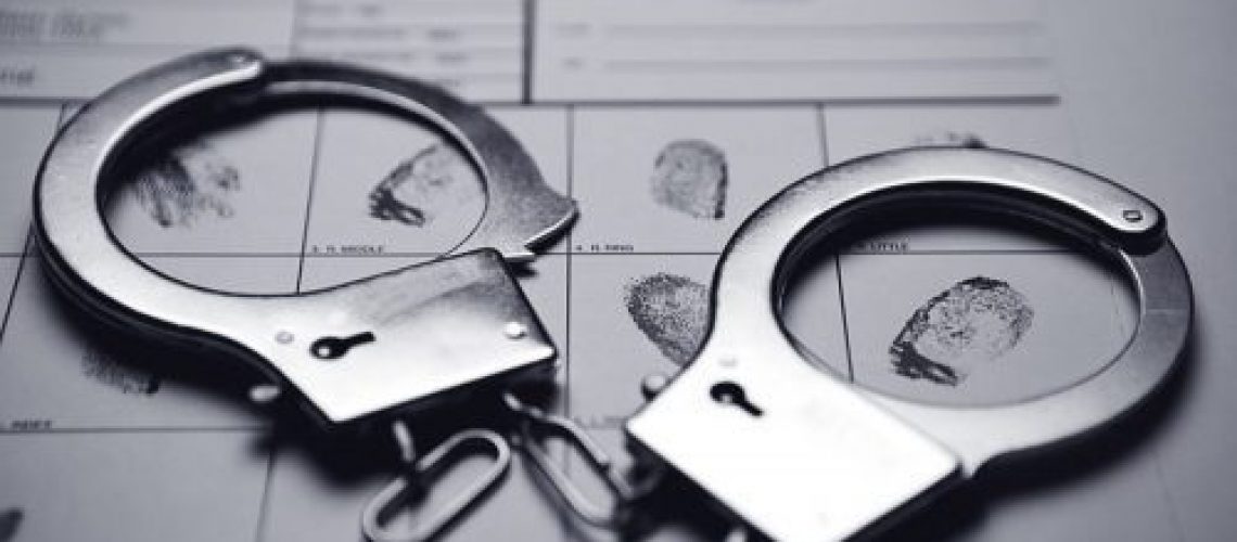 Handcuffs and fingerprints.
