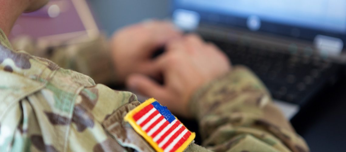 Military member on his laptop