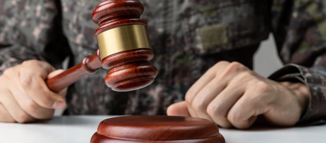 military man holding gavel